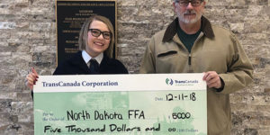 State FFA Vice President Morgan Krizan is pictured with Jeff Boyce of TransCanada.