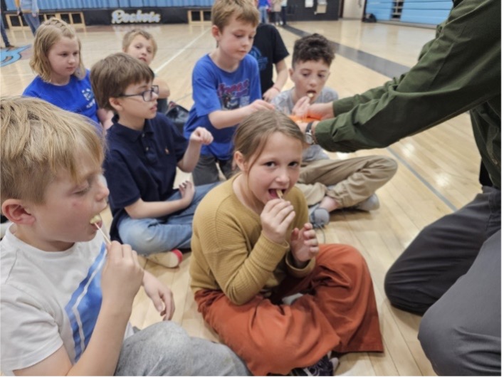 Students participating in the "Ag in the Gym" program, learning about dairy, sheep, and swine through hands-on activities funded by the ND FFA Foundation's Ag in the Classroom grant.