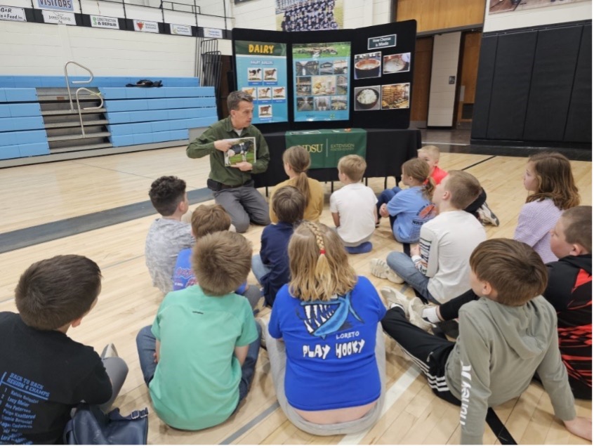 Students participating in the "Ag in the Gym" program, learning about dairy, sheep, and swine through hands-on activities funded by the ND FFA Foundation's Ag in the Classroom grant.