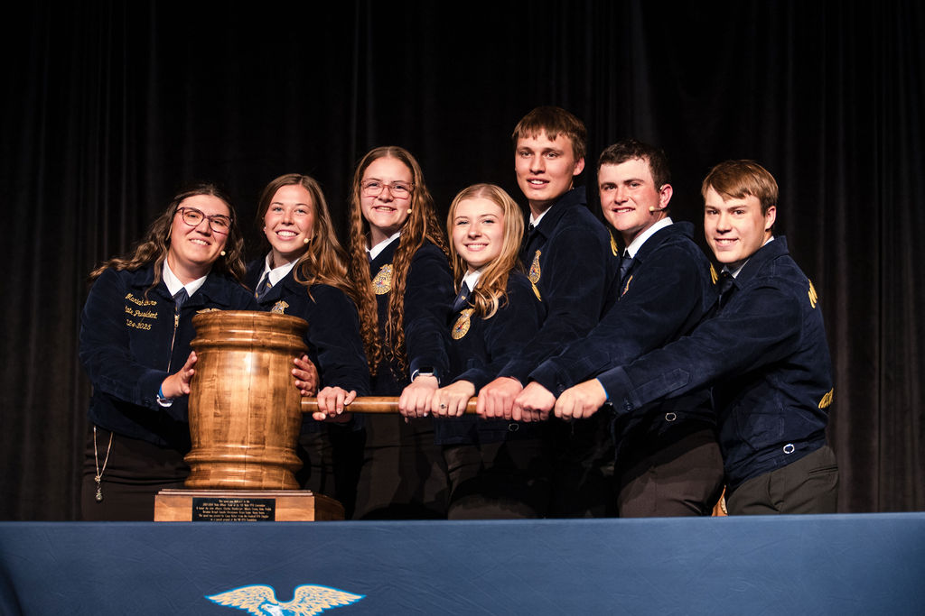 2024-2025 State FFA Officer Team dropping the gavel at the opening session of the 96th Annual State FFA Convention.